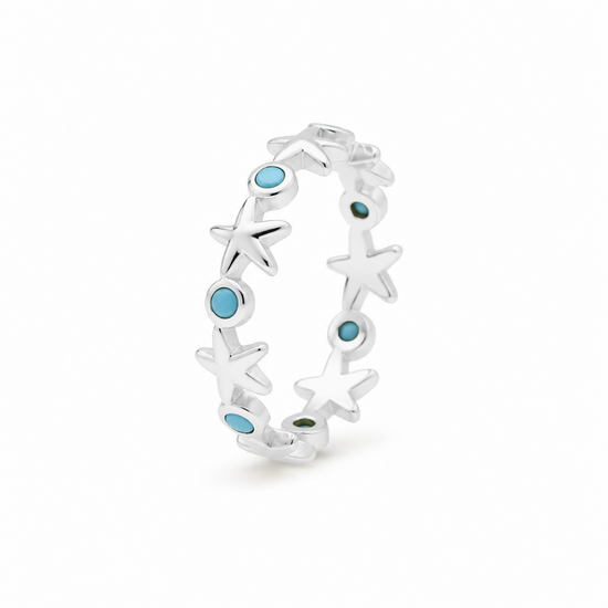 Anillo de estrellas de mar y detalles azules en plata 925, vista lateral