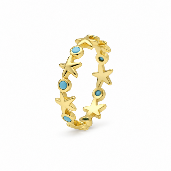 Anillo de estrellas de mar y detalles azules con baño en oro de 18kt, vista lateral